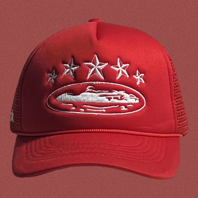 Corteiz Vintage Red Trucker Hat with White Stars and Cruise Ship Graphic Hover Image